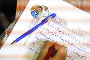 عکس| کتابت قرآن کریم توسط کودکان شیرازی