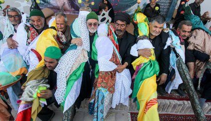 نخلگردانی «دُرُخش» نماد وفاداری علمدار کربلا