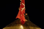 پرچم سیاه حرم امام حسین(ع) با آغاز ربیع الاول سرخ شد