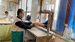 عکس/توزیع ۱۶هزار قرص نان صلواتی در آمل